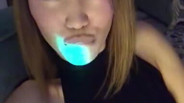 Казахская фифа эротично облизывает губы и гладит сиськи в платье